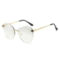 Frameless cat-eye sunglasses with gold metal frame and decorative leopard head detail - Gold Frame Silver Mirror Lens