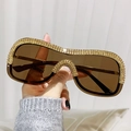Lunettes de soleil punk sans monture avec verres marron foncé et strass dorés sur le cadre - Monture Dorée Verres Ambrés