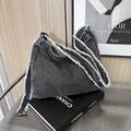 Frayed black denim shoulder bag with retro distressed edges and adjustable strap - Black