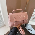 Pink minimalist crossbody bag with PAN TOR logo and stylish dual decorative buckles - Pink