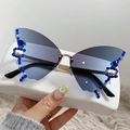 Randloze vlinder zonnebril met blauwe verloopglazen en sprankelende strassteentjes - Gouden Frame Grijs Blauwe Glazen