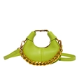 Chic green crescent bag with pebbled leather texture and decorative gold chain - Green