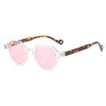 Retro oval sunglasses with transparent polygonal frames and pink lenses shown at 45-degree angle - Transparent Frame Pink Lens