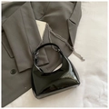 Minimalist black patent leather underarm bag with glossy finish and silver chain strap - Black