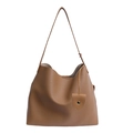 Brown lychee leather tote bag with slim shoulder strap and shield pendant decoration - Apricot