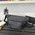 Dark grey textured washed denim waist bag with adjustable strap and dual zipper pockets - Black