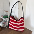 Woven tote bag with red and white stripes, mesh knit texture and black leather strap - Red