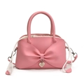 Borsa a secchiello rosa con grande fiocco e ciondolo a forma di cuore in metallo - Rosa