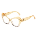 Chic cat-eye sunglasses with amber frame and tortoiseshell detail on a white background - Yellow Tortoise Split Frame Clear Lens