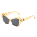 Chic cat-eye sunglasses in transparent yellow frame with dark lenses and gold logo - Yellow Tortoise Split Frame Grey Lens