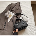 Classic black bowling bag with crocodile texture and adjustable strap on white bedding - Black (No Pendant)