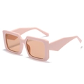Chic light pink square frame sunglasses with transparent orange lenses in 45-degree view - Pink Frame Champagne Lens