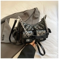 Quilted black leather underarm bag with silver chains and multiple utility pockets - Black