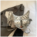 Close-up of silver quilted chain bag with metallic finish and multi-pocket design detail - Silver