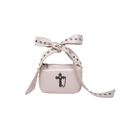Pink crossbody bag featuring studded bow handles and a black gothic cross charm - Pink