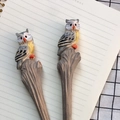 Handcrafted owl-shaped wooden carving pen with detailed feather textures and wood base - Grey Owl