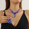Macro detail of royal blue teardrop rhinestone bridal jewelry set on female model - 2-Piece Set(GT25233) / Blue