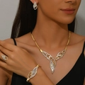 Close-up of elegant gold bridal jewelry set featuring leaf patterns with white rhinestones - 4-Piece Set(GT25248) / Gold