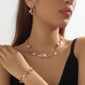 Detail of pink crystal bridal jewelry set with necklace, bracelet and earrings on model - 3-Piece Set(GT25254) / Gold Pink