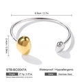 Detail view of two-tone stainless steel open cuff bangle with gold and silver bead ends - Irregular Gold Silver Bicolor Bean Style (STB-BC0047A)