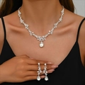 Silver bridal jewelry set featuring a pear-shaped rhinestone necklace and earrings - 2-Piece Set(GT25329) / Silver