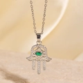 Hamsa Hand necklace with green marquise zircon and silver finish on silk background - Green Marquise Hamsa Hand Style (BXL0342-72)