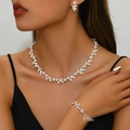 Elegant bridal rhinestone jewelry set with leaf patterns worn by a model - 3-Piece Set(GT25225) / Silver