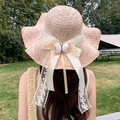 Pink woven straw sun hat with cream satin bow, floral accents and lace streamers - Pola Artificial Flower Pink