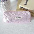 Close-up of pink heart-quilted waterproof storage bag with May Rabbit label - Large Heart Light Pink