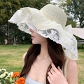 Elegant cream wide-brim straw sun hat with white lace embroidery and large bow detail - Bridal Style Creamy White