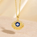 Collier Mauvais Œil doré avec pierre bleue et zircons sur fond en pierre - Style Œil Bleu Radial Doré (BXL0342-40)
