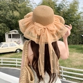 Women's light brown woven straw sun hat featuring a large mesh bow and pearl accents - Covered With Pearl Khaki