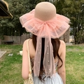Pink straw sun hat featuring a large mesh bow with white pearl accents for beach vacations - Pearl Pink Cover