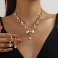 Golden bridal jewelry set with sparkling rhinestones featuring floral vine necklace and earrings - 2-Piece Set(GT25268) / Gold White