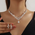 Elegant silver bridal jewelry set with floral rhinestones and teardrop pendant on model - 2-Piece Set(GT25277) / Silver