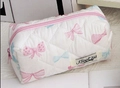 Quilted cotton storage pouch with pink bow prints and a smooth pink zipper closure - Colorful Bow