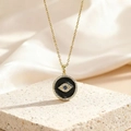 Collier œil maléfique doré avec pendentif en émail noir et zircon bleu sur une pierre - Style Œil Bleu Rond en Émail Noir (BXL0342-139)