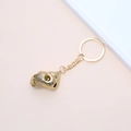Golden spiral shell keychain accessory with a glossy metallic finish on pink background - 25# (Gold Curled Shell)