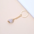 Golden keychain with natural purple spiral seashell pendant on minimalist background - 18# (Spiral Bumpy Conch)