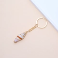 Natural sea shell keychain with gold trim and spiral conch design for handbags - 45# (Purple Gradient Textured Long Screw Shell)