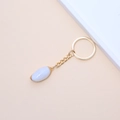 Golden keychain featuring a light blue oval seashell pendant on a beige background - 44# (Light Blue Oval Pendant Charm)