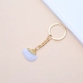 Golden natural seashell keychain featuring a white scallop pendant on beige background - 53# (White Wavy Scallop)