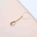 Golden sea shell keychain with a natural white cowrie pendant and gold plated edges - 51# (White Gold Color Scheme Shell)