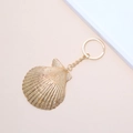 Golden scallop shell keychain charm with radial texture on a pink background - 54# (Gold Radial Scallop)