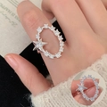 Elegant silver ring with star-shaped zircon and pave settings on female finger - Open Adjustable / Starry Oval