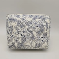 Detailed macro view of diamond quilted floral pattern and metal zipper on makeup bag - M / Medium Blue Floral