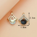 Gold alloy heart pendant with large faceted black stone and sparkling crystal accents - Crown / Black