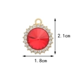 Golden alloy circular pendant with central red gem and small clear crystals, 2.1cm high - Round Zircon / Red
