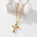 Detailed macro view of gold cross pendant with colorful gemstones on a Cuban chain - Gold/Multicolor Oval Gem Cross/Cuban Chain/B1