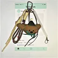 Brown plush bear keychain with green party hat and cream braided rope accessory - Spring Rope Pendant / Long-eared Dog